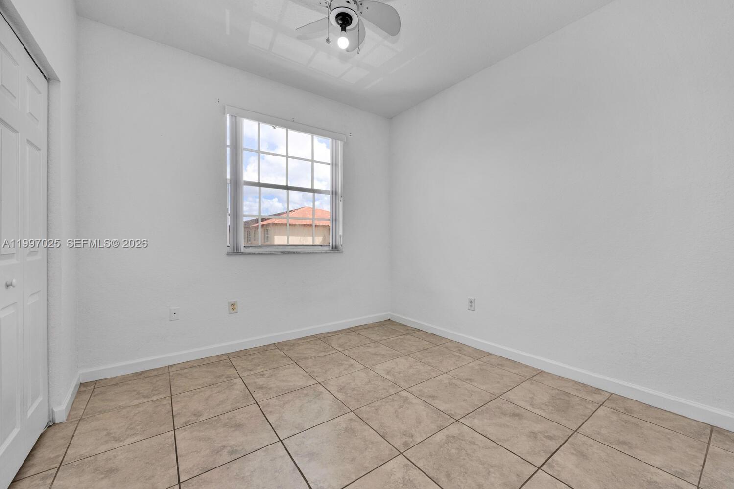 12864 Southwest 133rd Terrace Miami, FL 33186 - Photo 15 of 26 an empty room with windows