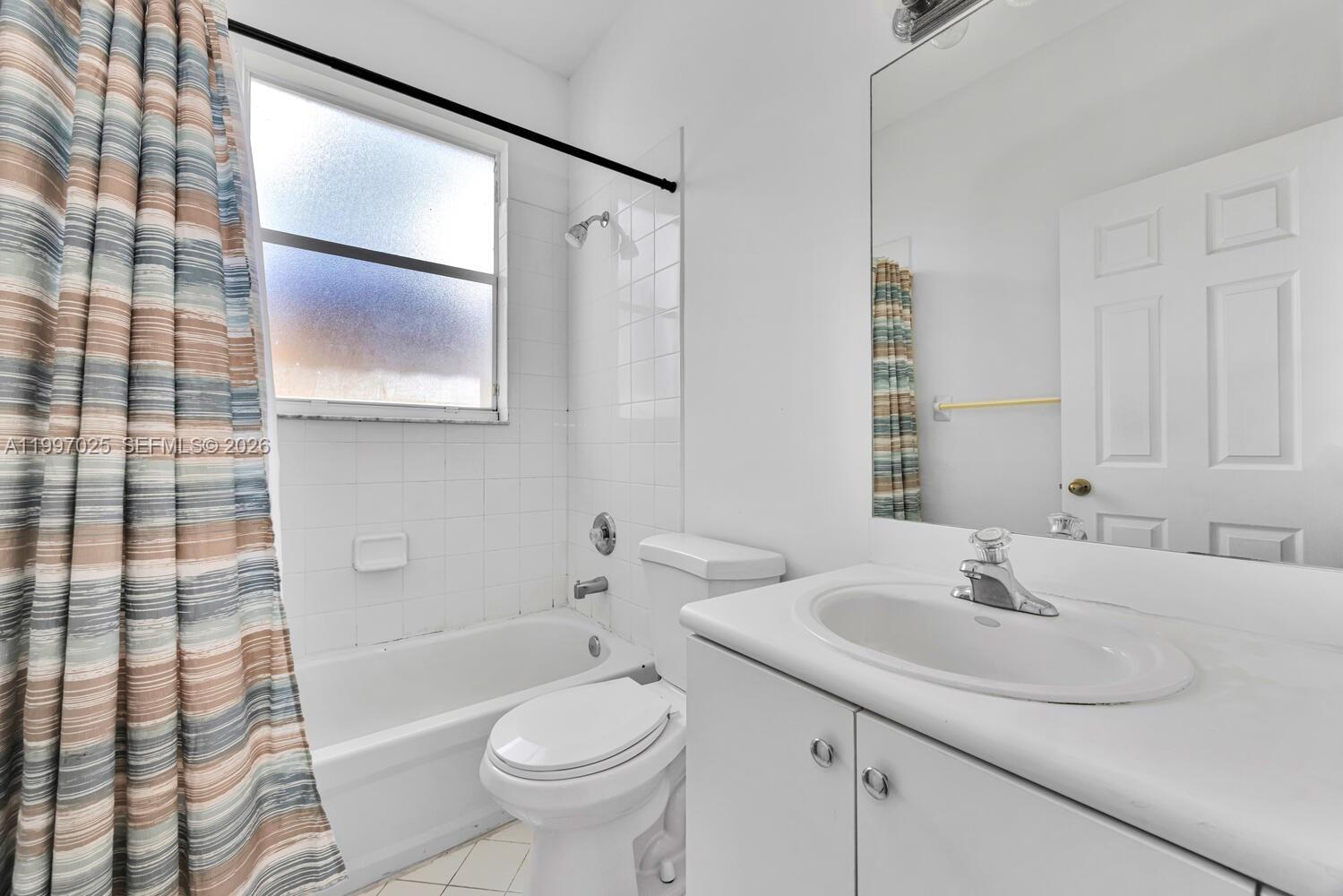 12864 Southwest 133rd Terrace Miami, FL 33186 - Photo 17 of 26 a bathroom with a sink toilet and shower