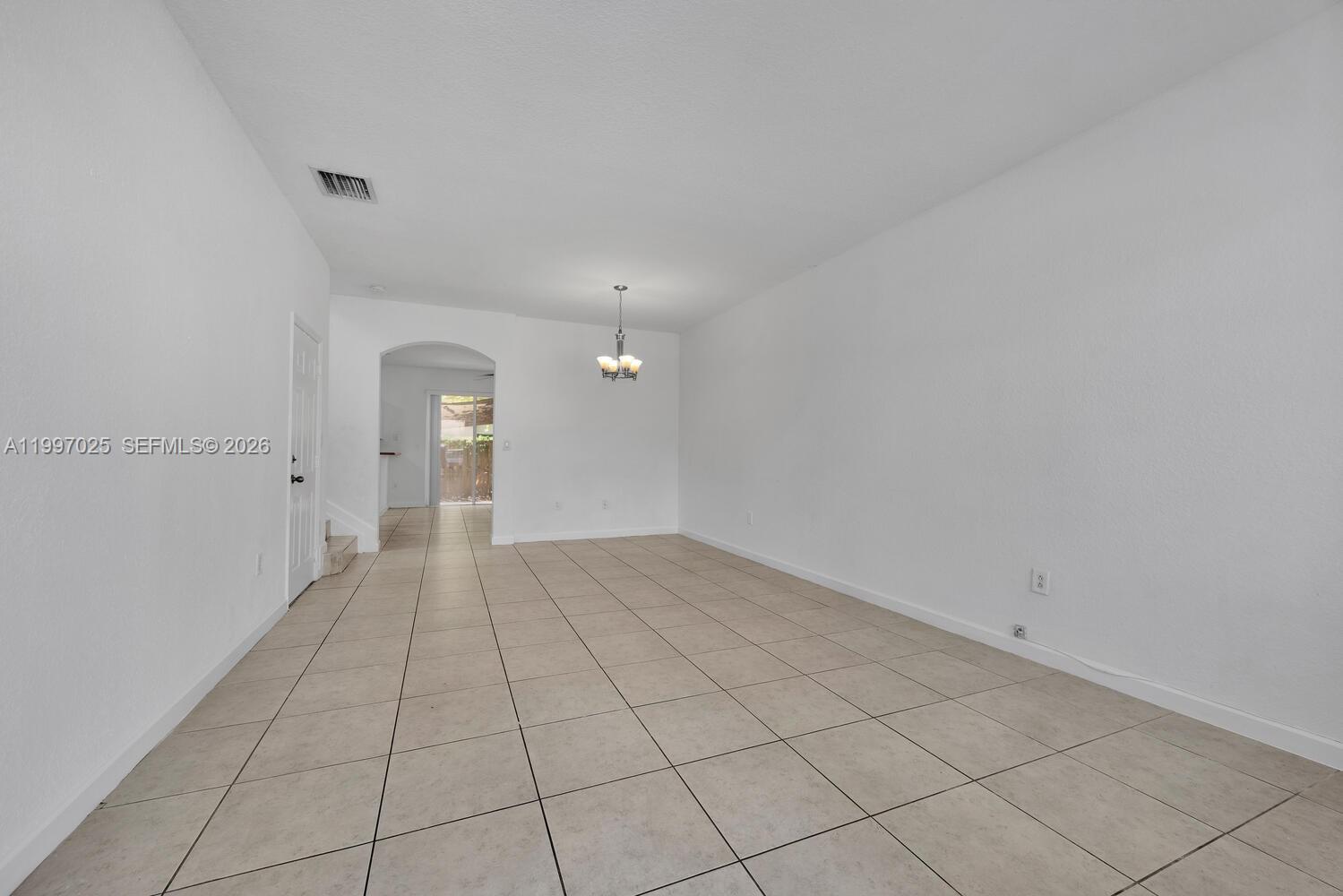 12864 Southwest 133rd Terrace Miami, FL 33186 - Photo 2 of 26 a view of an empty room and window
