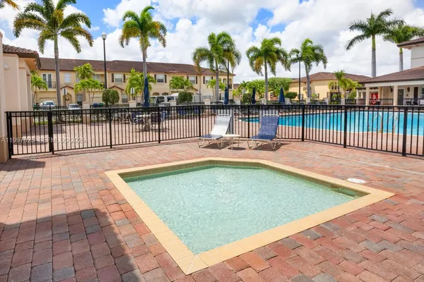 a view of a swimming pool with a patio