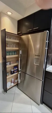 a bathroom with a granite countertop toilet sink and mirror