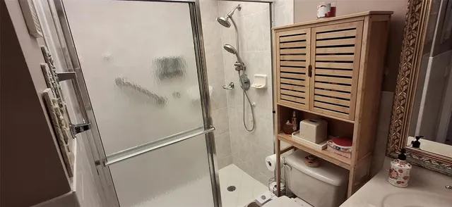 a view of a house with a big yard plants and large trees