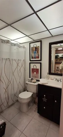 a view of a swimming pool with outdoor seating and plants