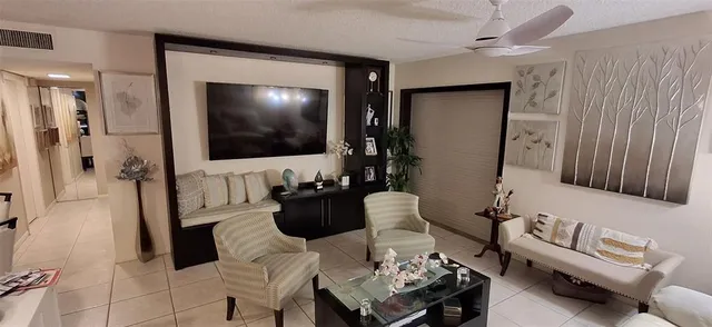 a bedroom with a bed and a potted plant