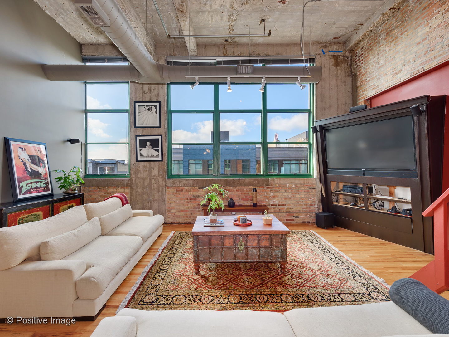 1017 West Washington Boulevard, Unit 6F Chicago, IL 60607 - Photo 11 of 20 a living room with furniture and a flat screen tv