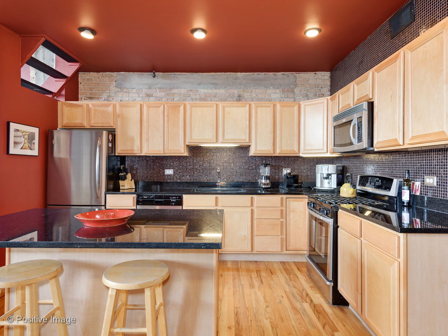 1017 West Washington Boulevard, Unit 6F Chicago, IL 60607 - Photo 3 of 20 a kitchen with stainless steel appliances granite countertop a stove a sink and a refrigerator