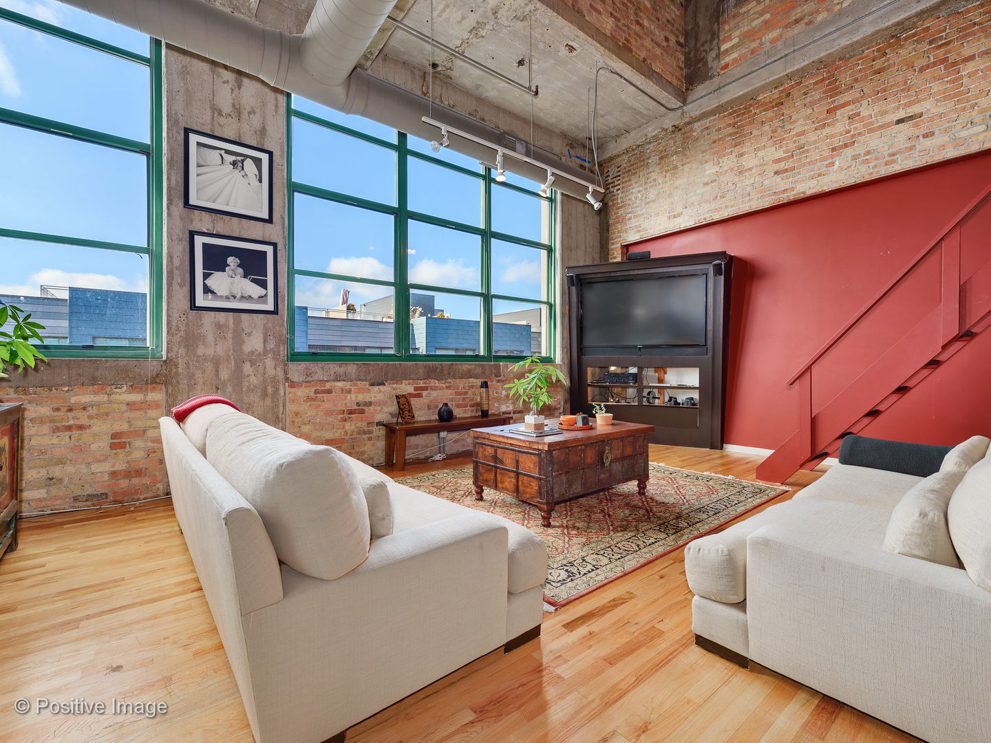 1017 West Washington Boulevard, Unit 6F Chicago, IL 60607 - Photo 8 of 20 a living room with furniture fireplace and a flat screen tv