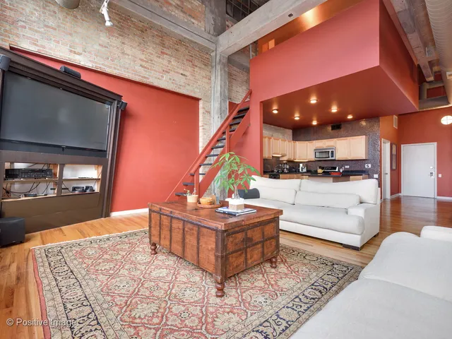 a living room with fireplace furniture and a flat screen tv