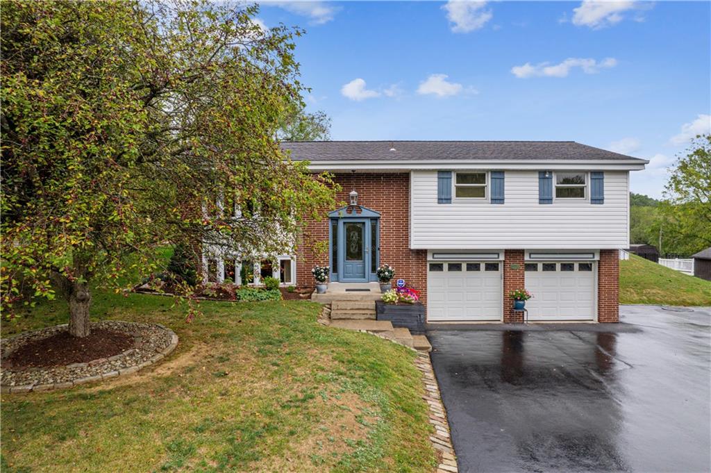 250 Victory Road Saxonburg, PA 16056 - Photo 1 of 33 a front view of a house with a yard