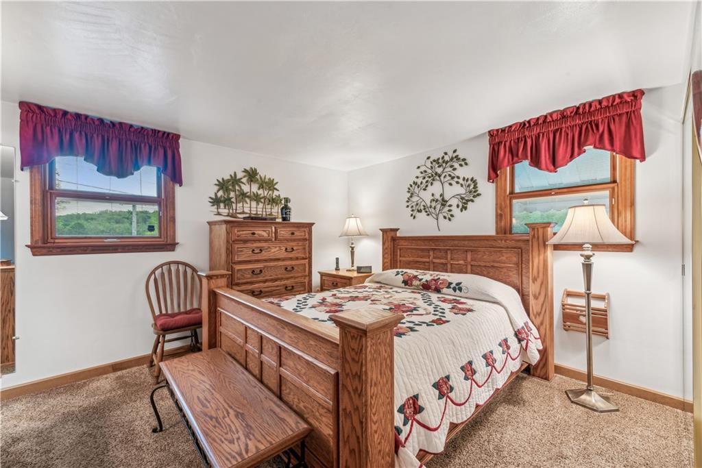 250 Victory Road Saxonburg, PA 16056 - Photo 11 of 33 a bedroom with a bed and a chair with painting on the wall