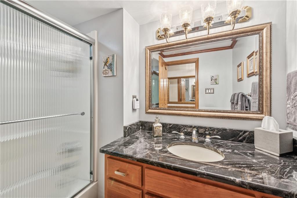 250 Victory Road Saxonburg, PA 16056 - Photo 17 of 33 a bathroom with a granite countertop sink and a mirror