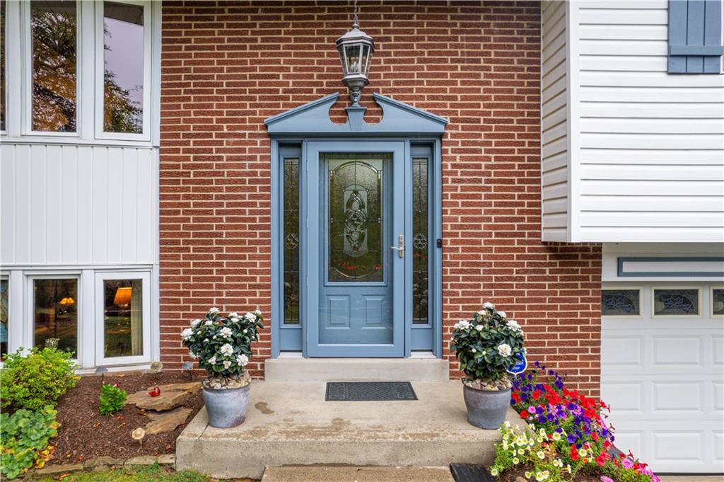 250 Victory Road Saxonburg, PA 16056 - Photo 2 of 33 a front view of a house with a garden