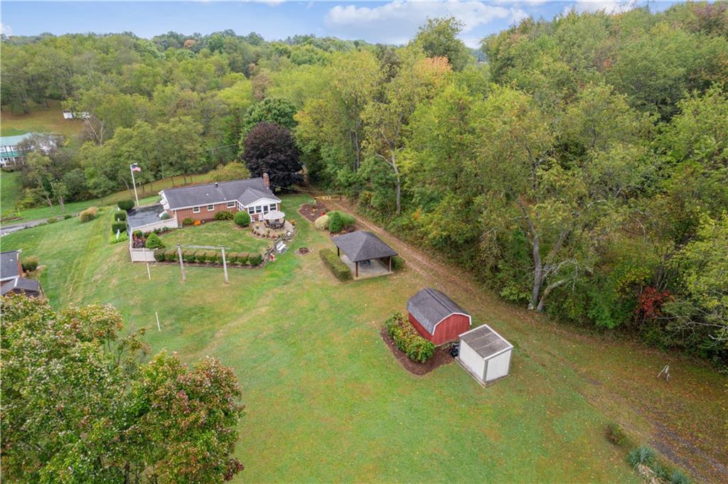 250 Victory Road Saxonburg, PA 16056 - Photo 23 of 33 an aerial view of a house with pool yard outdoor seating and yard