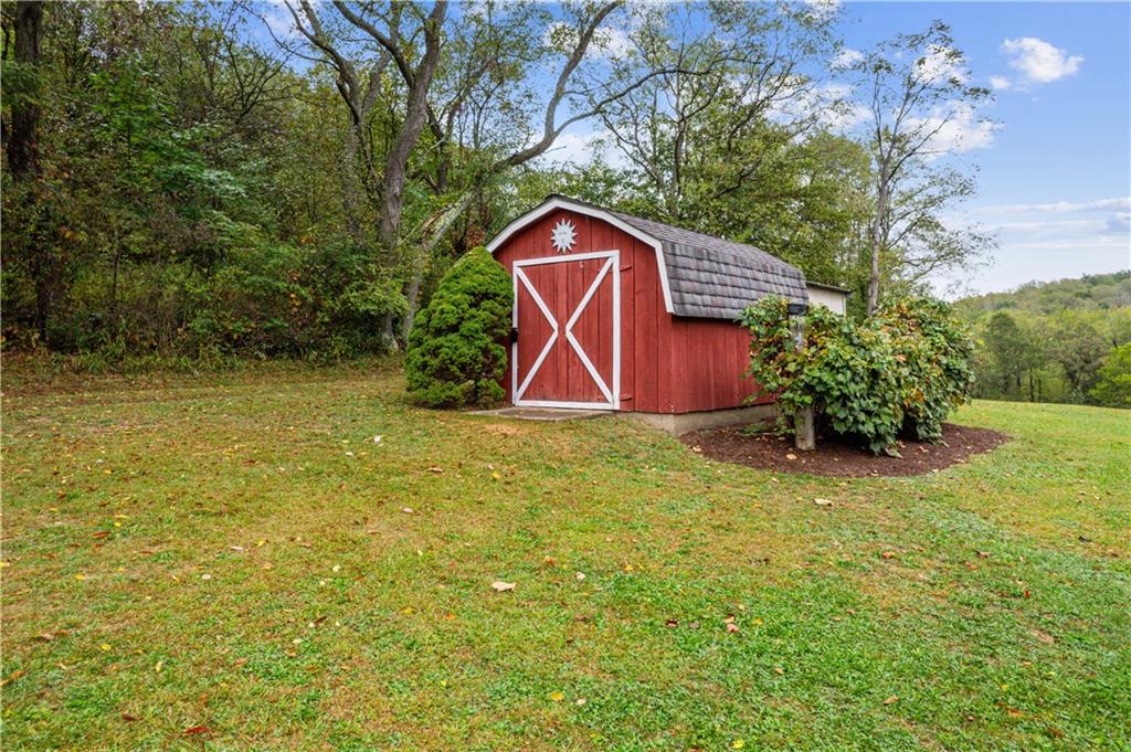 250 Victory Road Saxonburg, PA 16056 - Photo 32 of 33 a backyard of a house with lots of green space