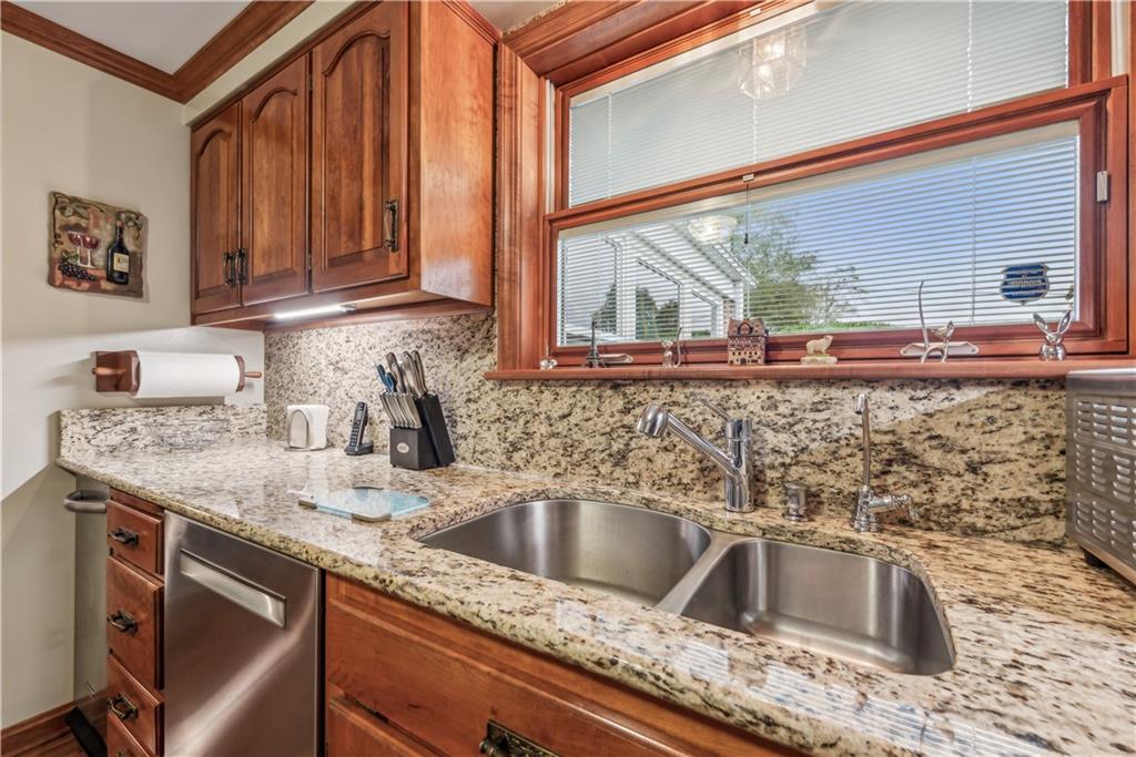 250 Victory Road Saxonburg, PA 16056 - Photo 7 of 33 a kitchen sink with granite countertop a sink and cabinets