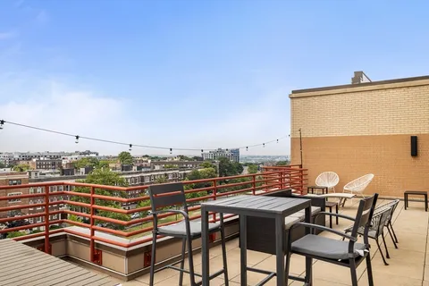 a view of a terrace with seating area