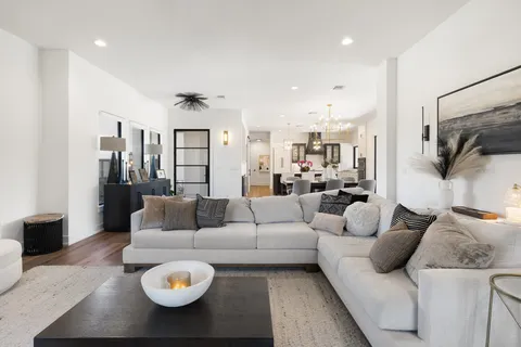 a living room with furniture and a table
