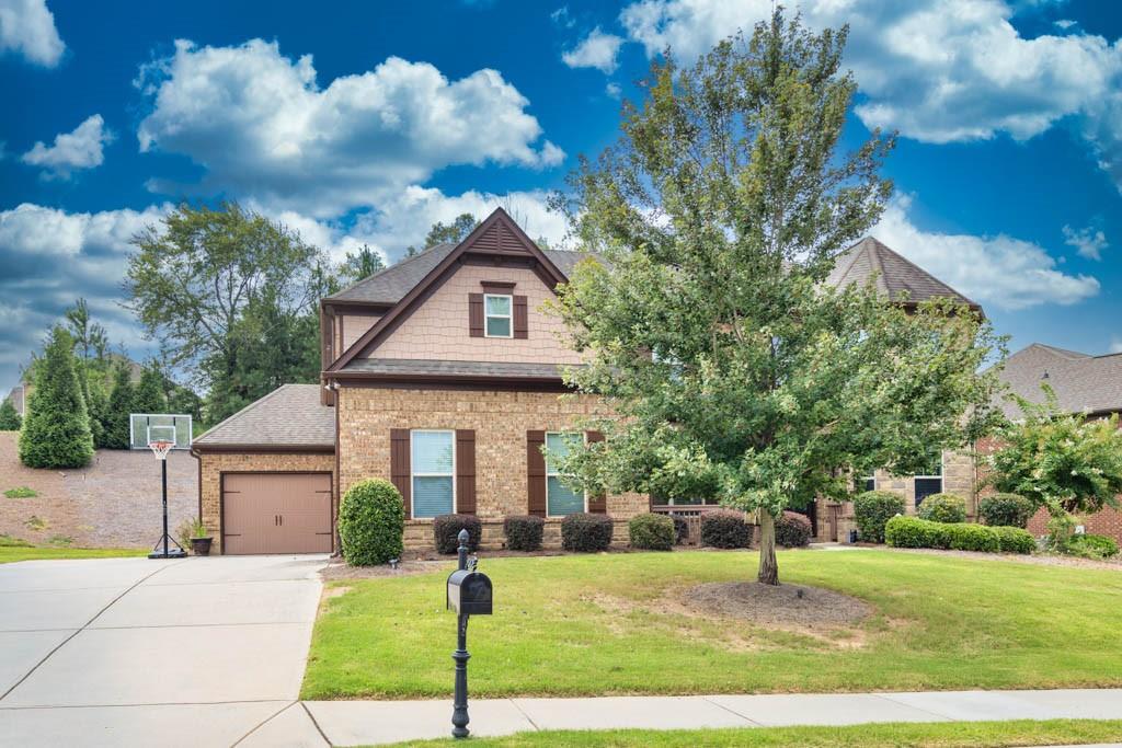 825 Reserve Point Place Suwanee, GA 30024 - Photo 1 of 1 a front view of a house with a yard