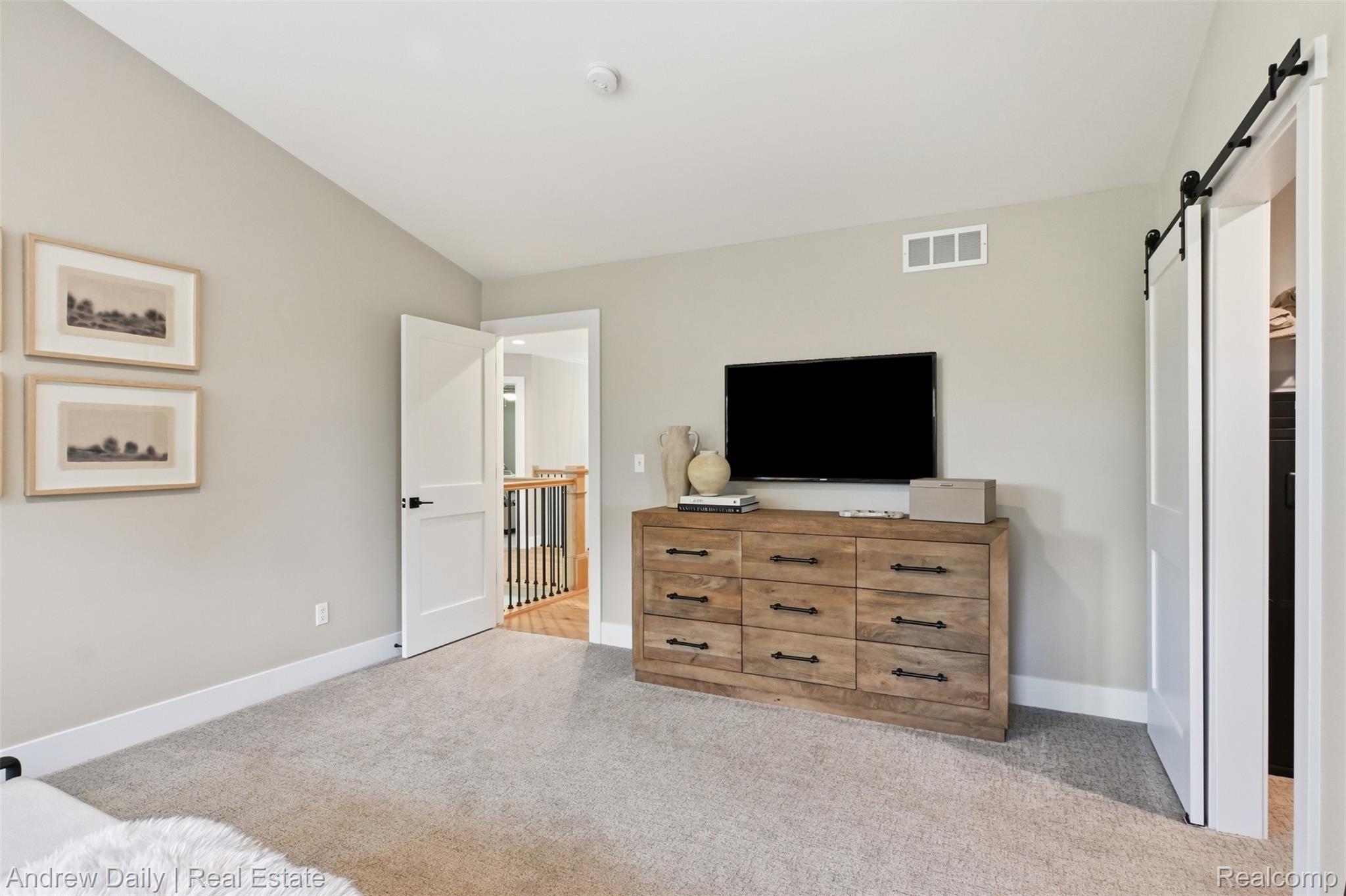 4661 Spears Road Pinckney, MI 48169 - Photo 39 of 57 Carpeted room featuring light gray walls, white baseboards, and a white door with black hardware