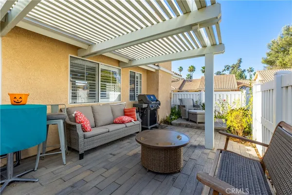 a living room with furniture a fireplace and a table