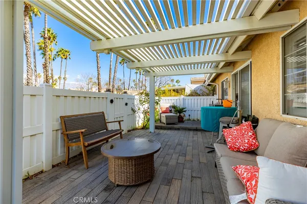 a living room with furniture a window and flowerpot