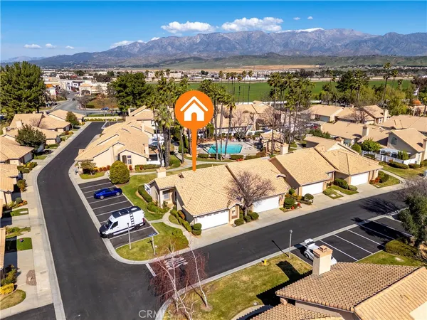 a view of a balcony with dining table and chairs