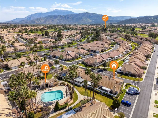 an aerial view of residential houses and outdoor space