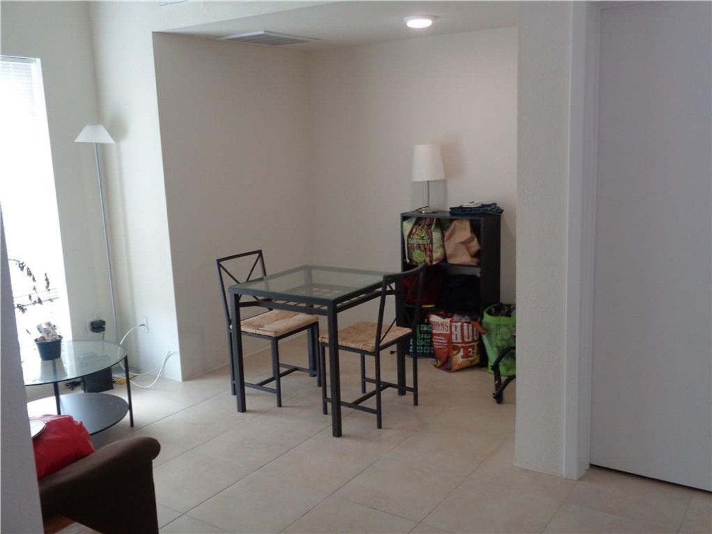 210 East 32nd Street, Unit E Austin, TX 78705 - Photo 24 of 24 a dining room with furniture and a chandelier fan