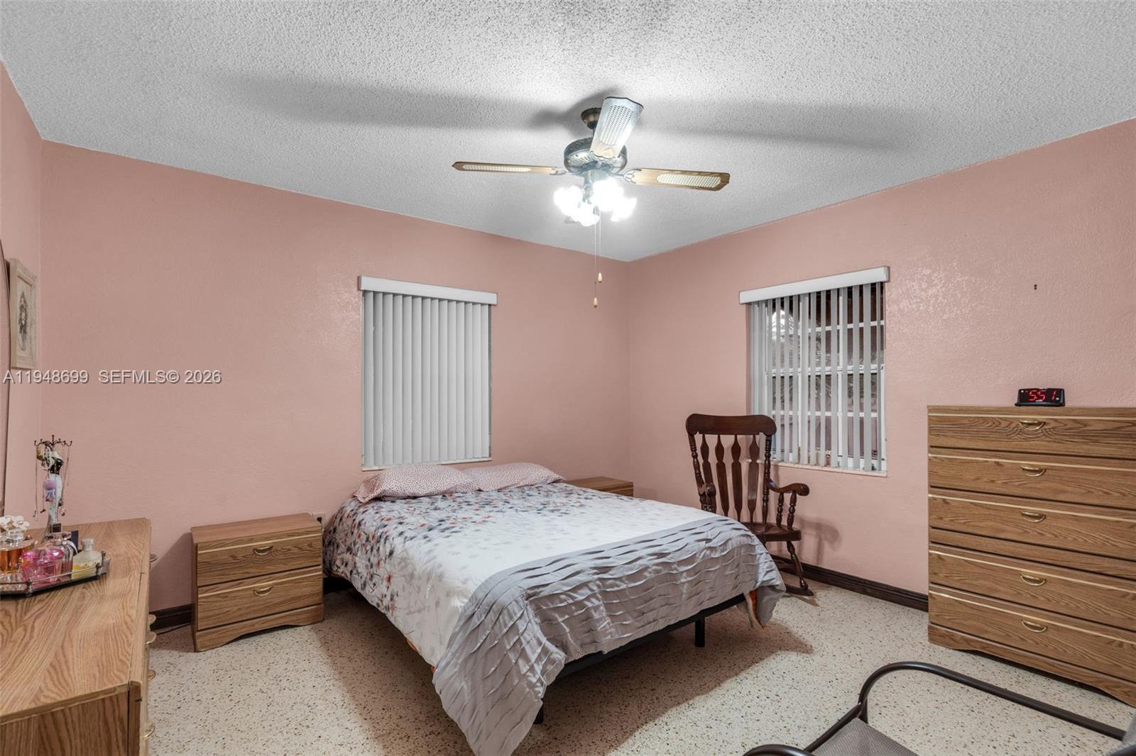 2671 Southwest 30th Avenue Miami, FL 33133 - Photo 28 of 43 a bedroom with a bed and a chandelier