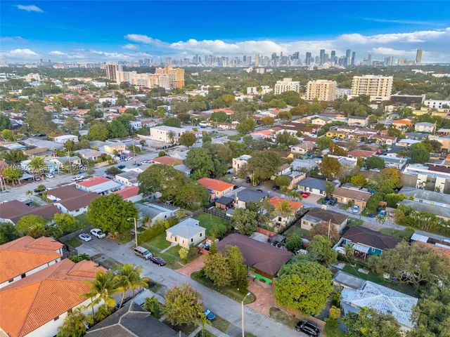 an aerial view of residential houses with outdoor space