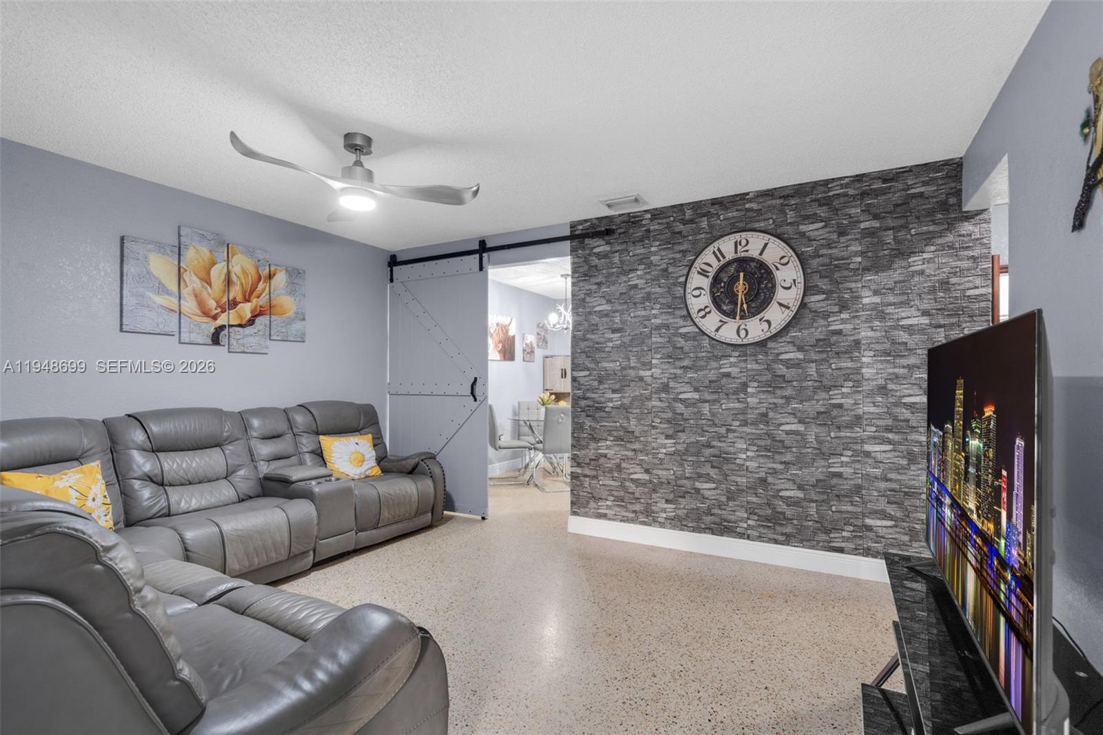 2671 Southwest 30th Avenue Miami, FL 33133 - Photo 4 of 43 a living room with furniture and a flat screen tv