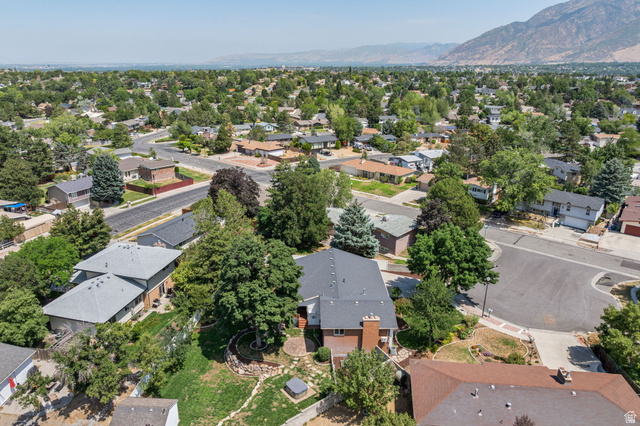2370 Quail Run Circle East Sandy, UT 84093 - Photo 52 of 54 Expansive neighborhood setting with mature trees and mountain backdrop