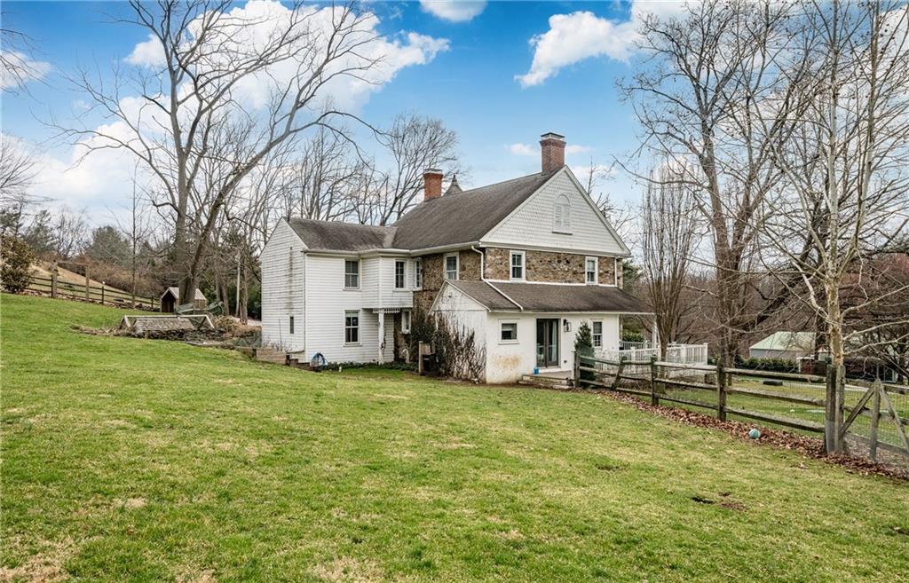 701 Oakbourne Road West Chester, PA 19382 - Photo 44 of 50 a view of a house with a big yard and large trees