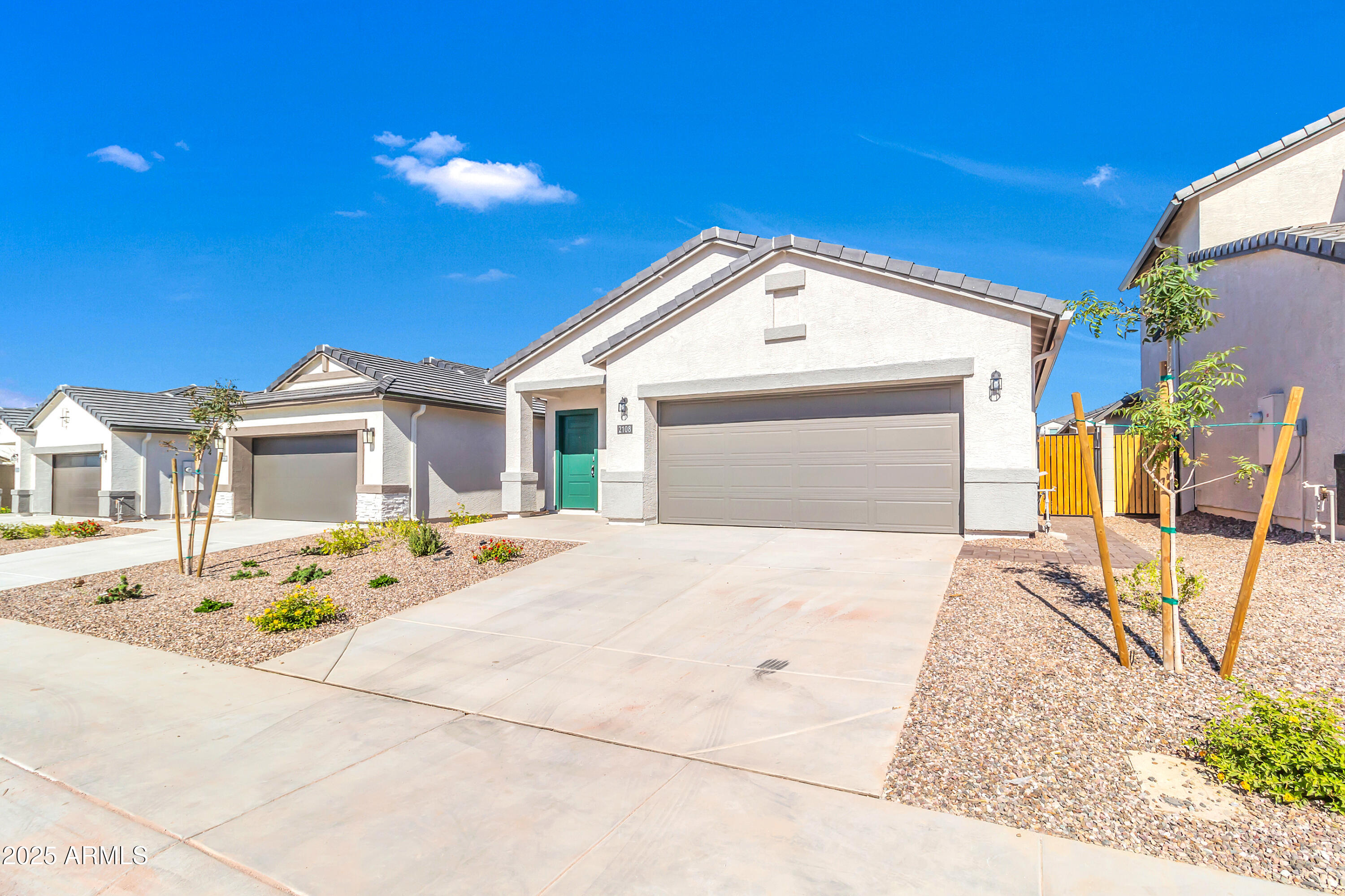 2108 West Sheridan Avenue Apache Junction, AZ 85120 - Photo 2 of 49 a front view of a house with a yard