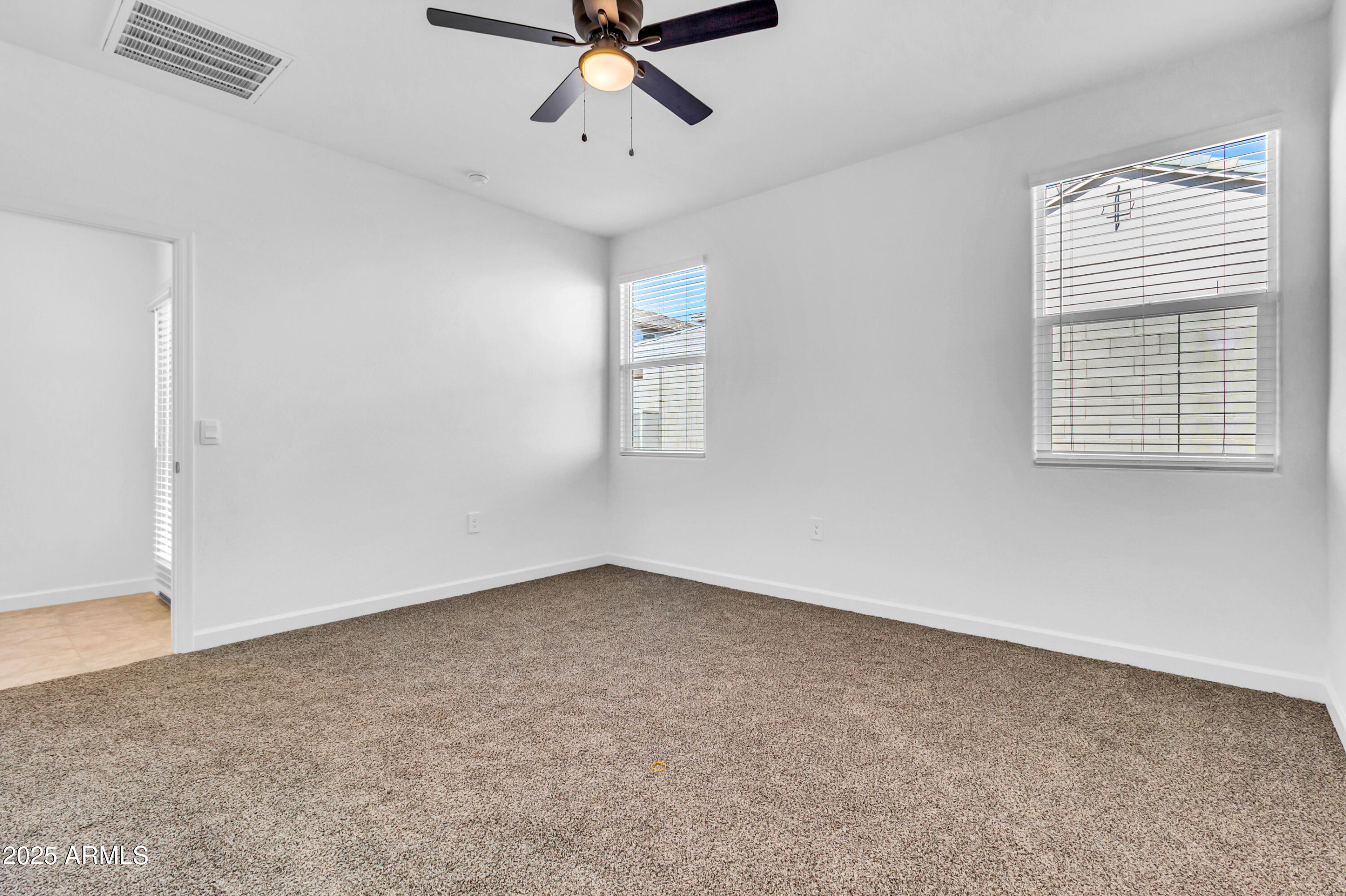 2108 West Sheridan Avenue Apache Junction, AZ 85120 - Photo 21 of 49 a view of an empty room with a window