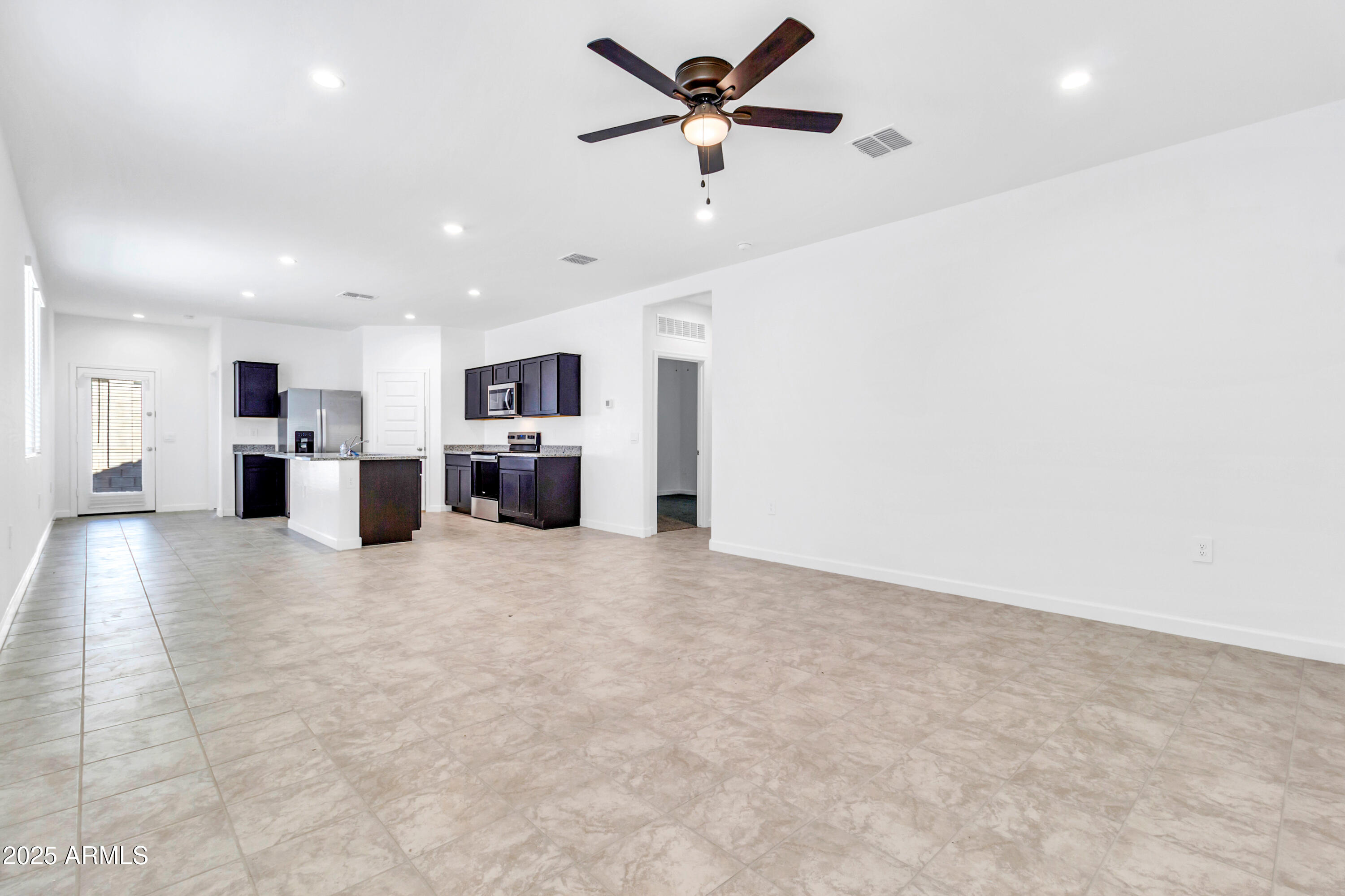 2108 West Sheridan Avenue Apache Junction, AZ 85120 - Photo 4 of 49 a view of a kitchen with a stove cabinets and a kitchen