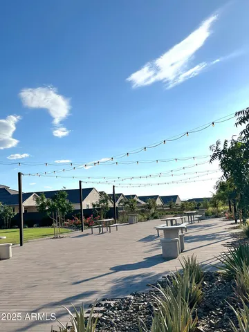a living room with fireplace furniture and a rug