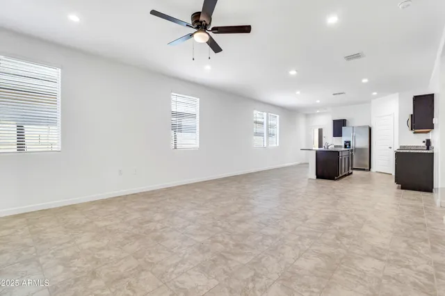 a view of an empty room and a window