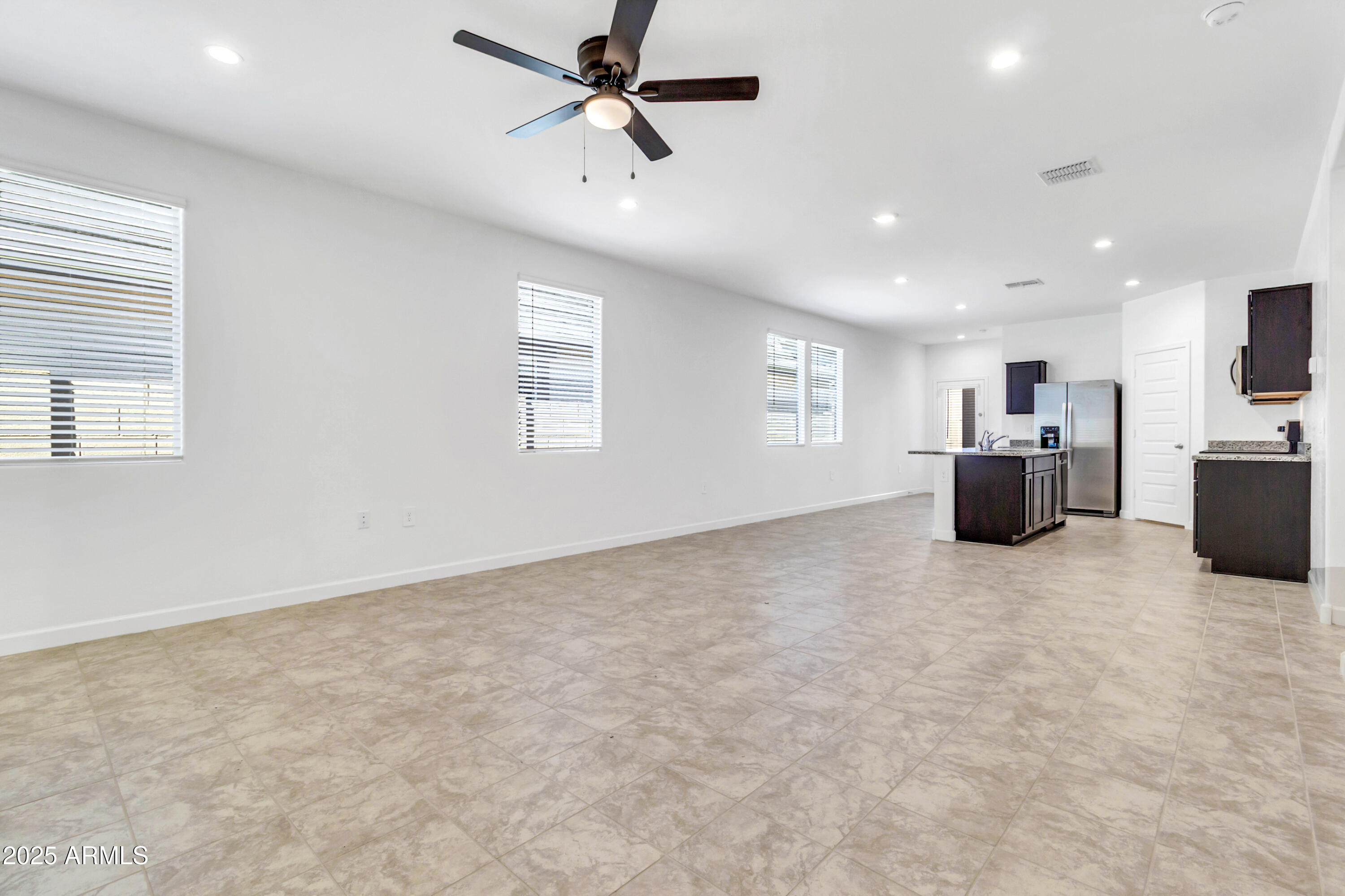 2108 West Sheridan Avenue Apache Junction, AZ 85120 - Photo 6 of 49 a view of an empty room and a window