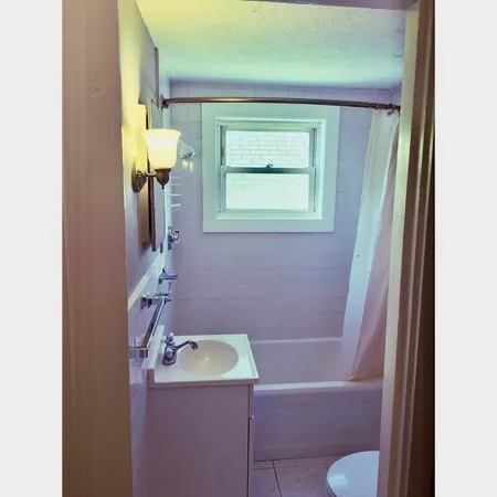 a bathroom with a toilet and a sink