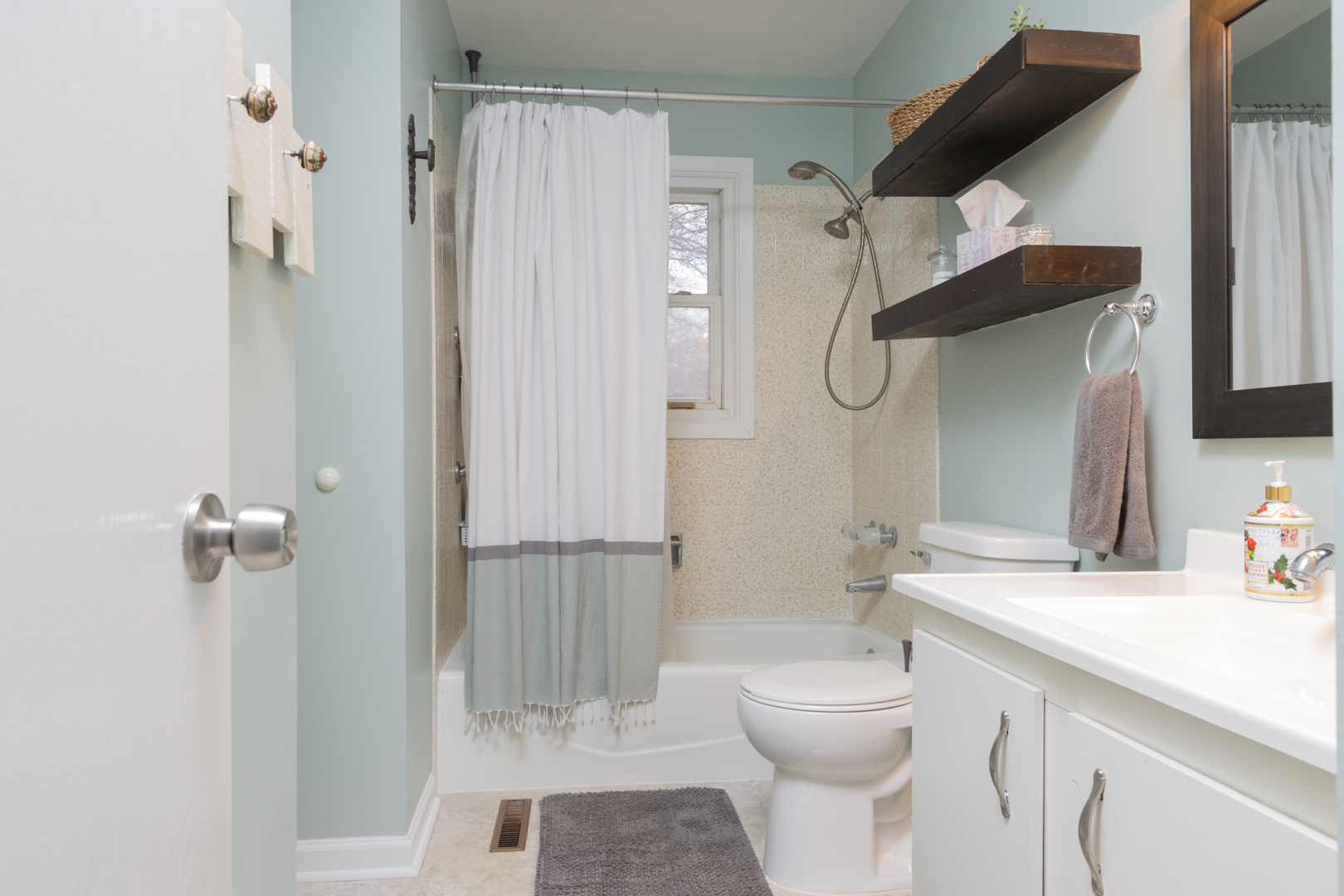 202 Augusta Drive McHenry, IL 60050 - Photo 11 of 18 a bathroom with a sink a toilet and shower