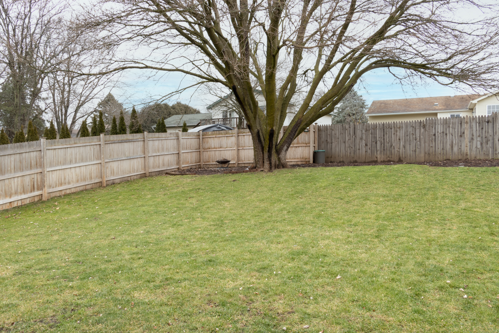 202 Augusta Drive McHenry, IL 60050 - Photo 18 of 18 a view of a yard with a trees