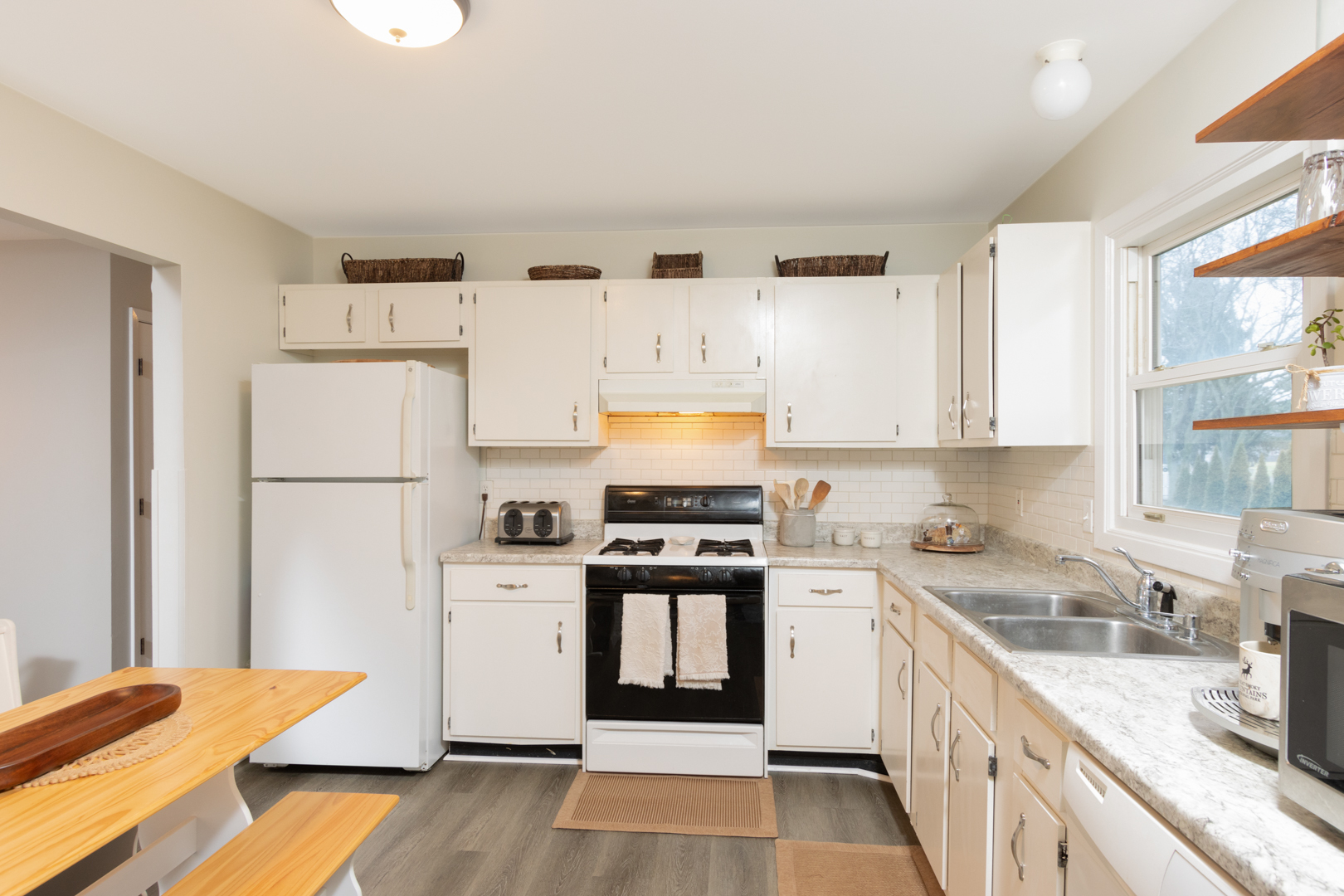 202 Augusta Drive McHenry, IL 60050 - Photo 5 of 18 a kitchen with stainless steel appliances granite countertop a stove a sink dishwasher and a refrigerator