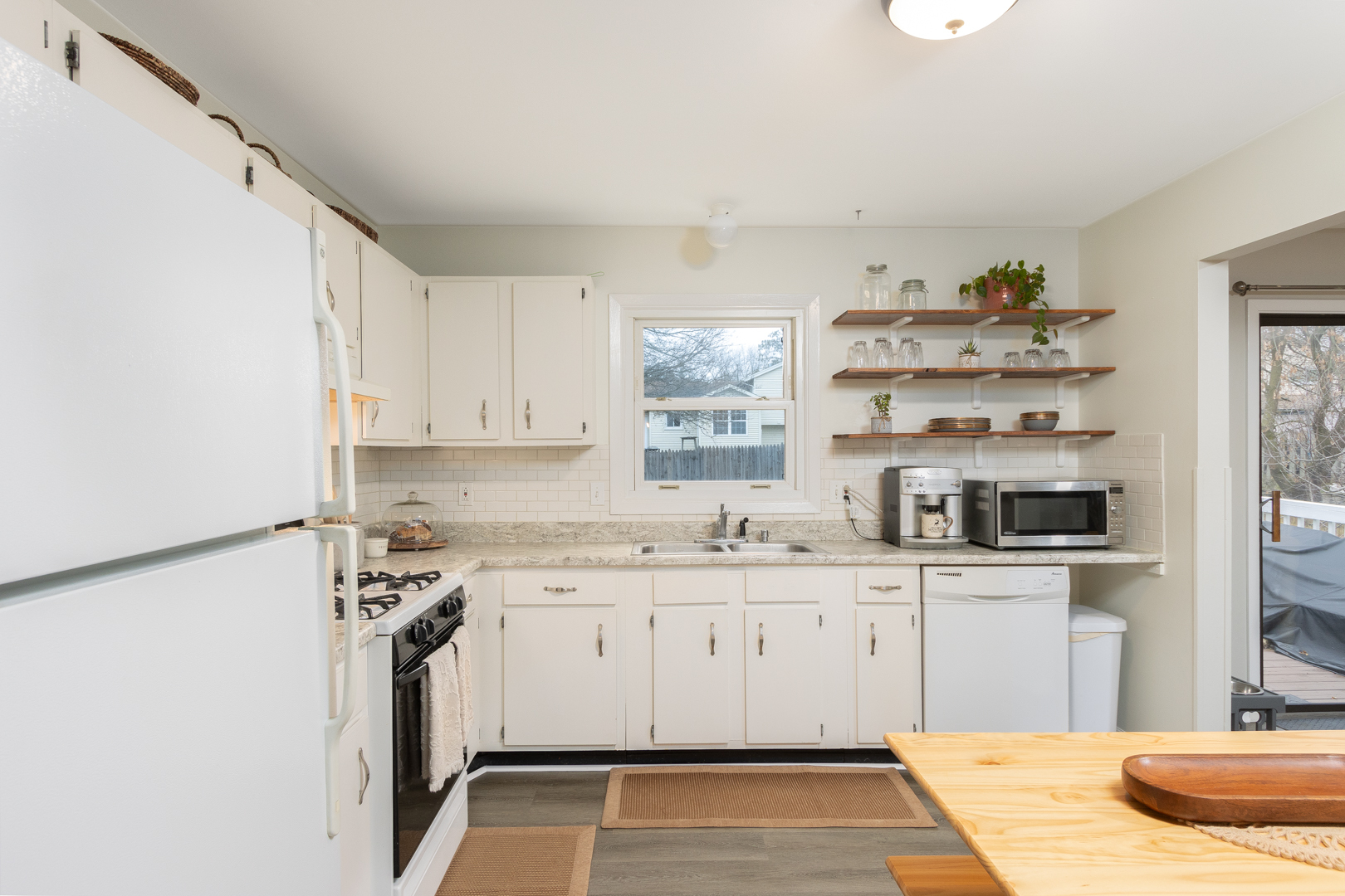 202 Augusta Drive McHenry, IL 60050 - Photo 6 of 18 a kitchen with granite countertop a sink and cabinets