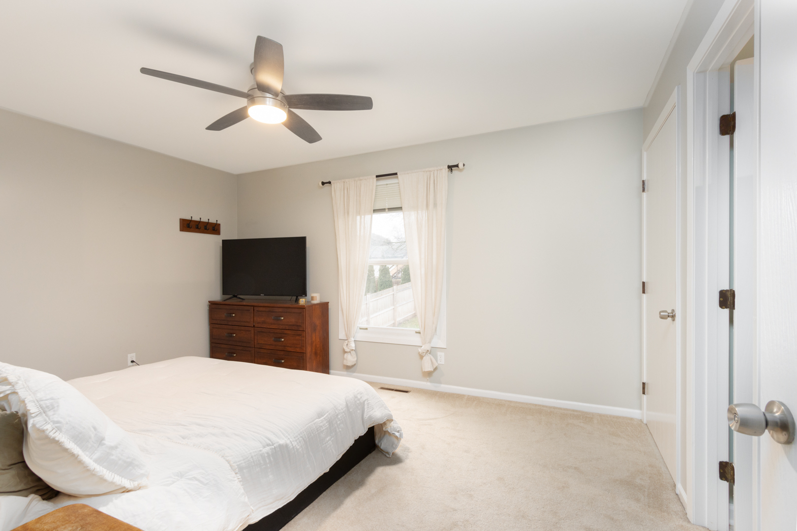 202 Augusta Drive McHenry, IL 60050 - Photo 9 of 18 a bedroom with a bed and a flat screen tv