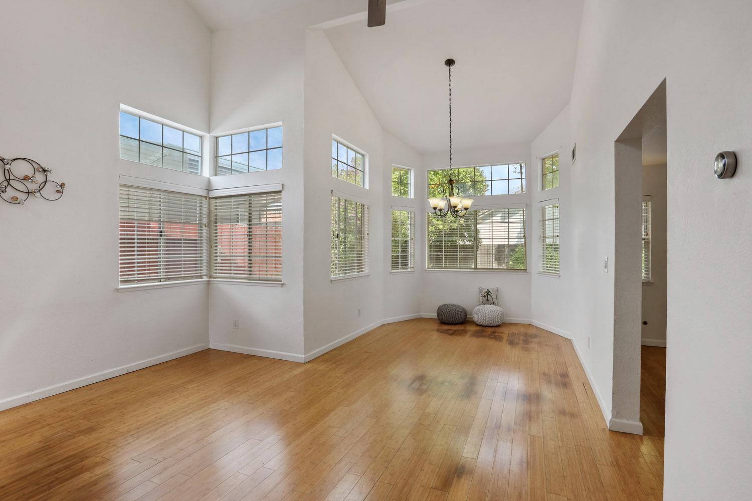 145 Machado Court Tracy, CA 95376 - Photo 6 of 28 a bedroom with window and a chandelier