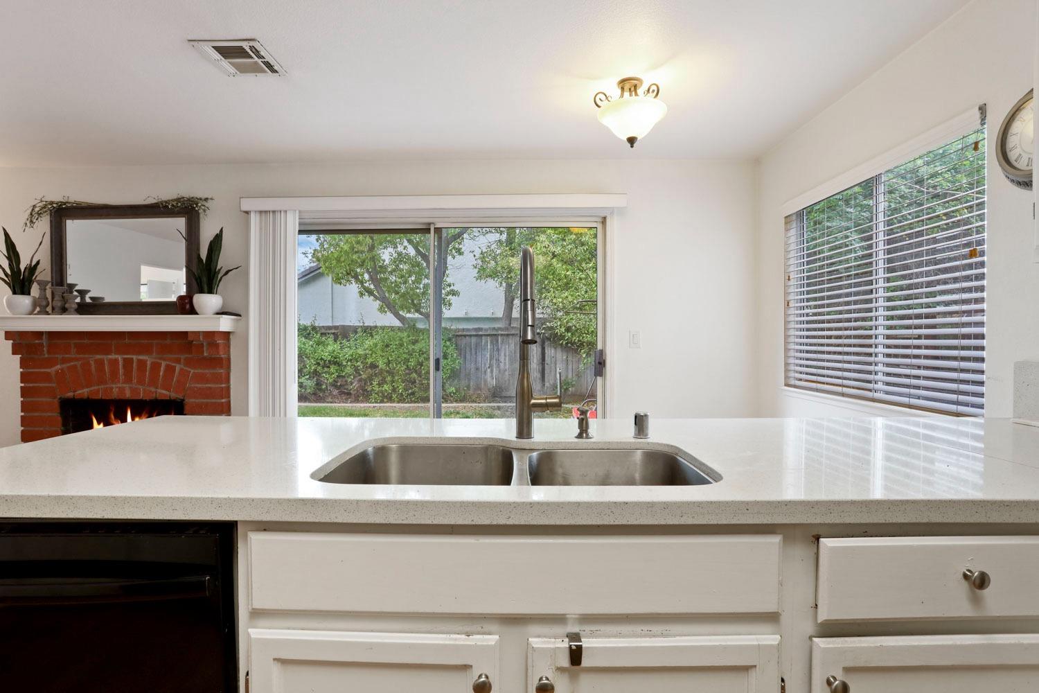 145 Machado Court Tracy, CA 95376 - Photo 9 of 28 a living room with furniture and large windows