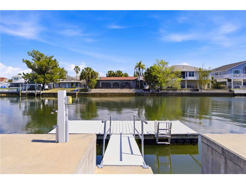 4530 Gulfstream Drive Hernando Beach, FL 34607 - Photo 12 of 16 a view of a lake with houses