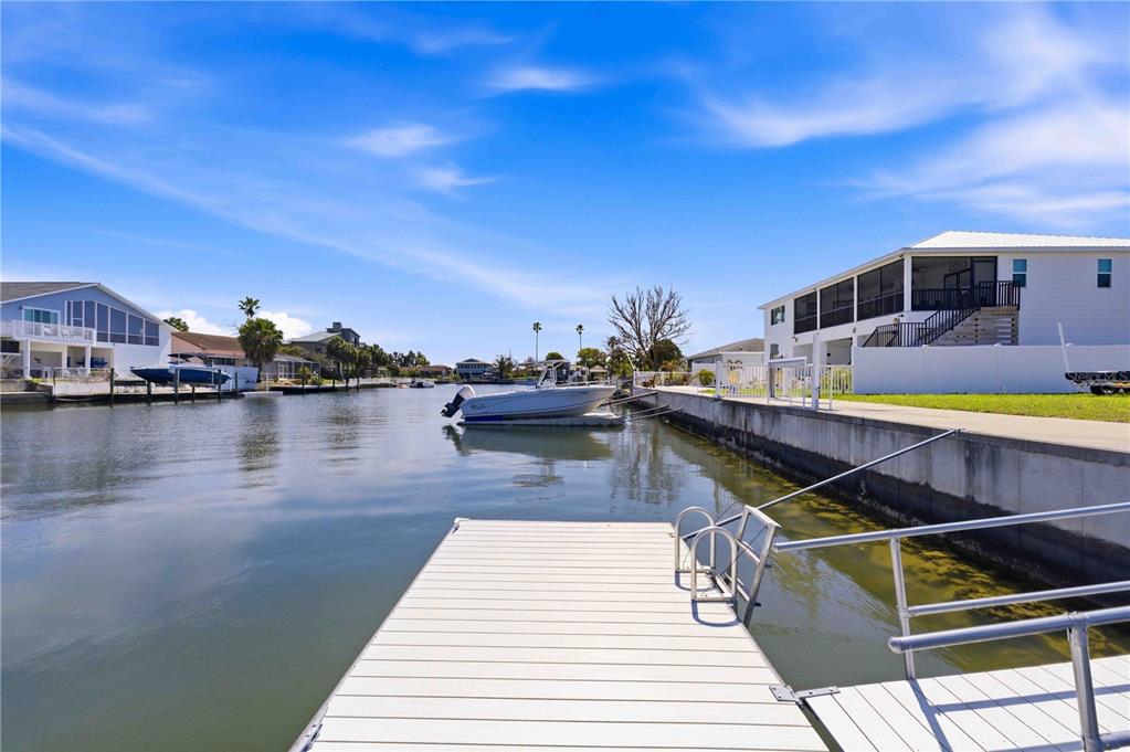 4530 Gulfstream Drive Hernando Beach, FL 34607 - Photo 14 of 16 a view of a swimming pool with an outdoor seating