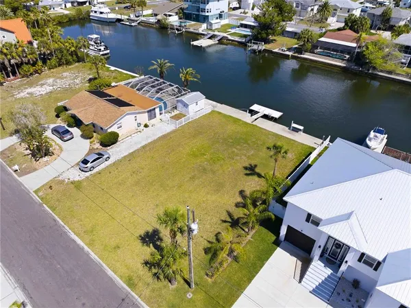 an aerial view of a house with a swimming pool